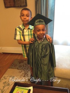 Big brother posing with the graduate